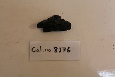 Small angular piece of coal