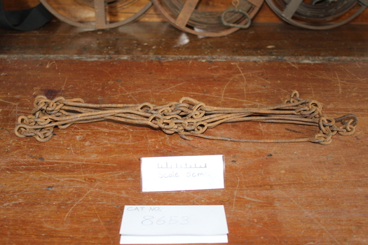 A broken section of rusted Gunter Chain