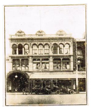 An old sepia photograph of a city building.
