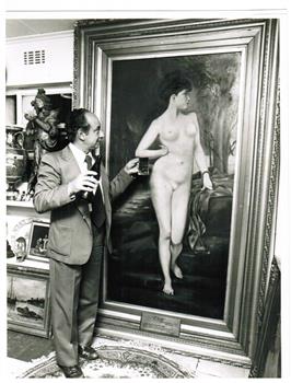 A man standing beside the portrait of Chloe.