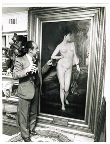 A man standing beside the portrait of Chloe.