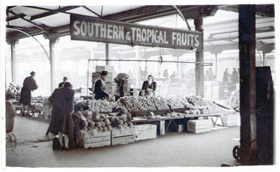 Two fruit stall owners at the Queen Victoria market