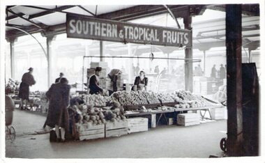 Two fruit stall owners at the Queen Victoria market