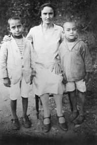 Two young boys with their mother.
