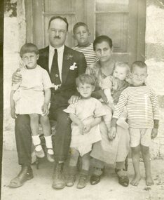 A family group of the parents and five children.