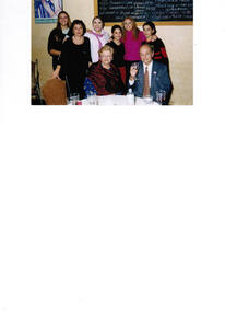 A couple photographed with their daughters and granddaughters.