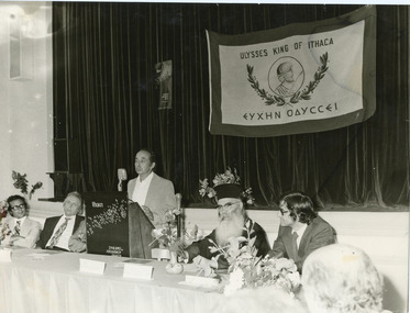 A man addressing a meeting.