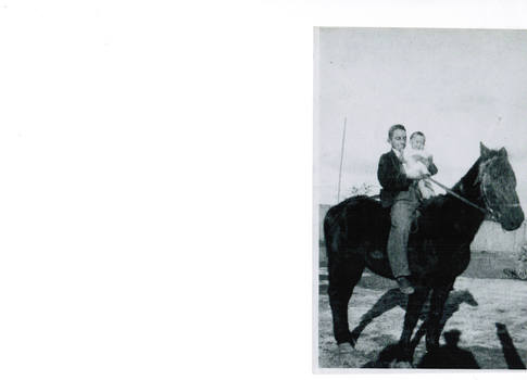A young boy holding an infant child on a horse.