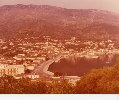 A view of a harbour town taken from an elevated position.