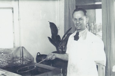 Photograph, Dimitrios Sofianos in his fish and chip shop, Late 1940s