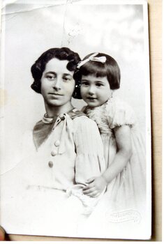 A studio photograph of a lady and little girl.