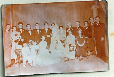 A family photograph of a wedding.