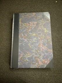 Illustrated hardcover book with dark blue/grey/red/gold marble effect front and back cover. Black leather corners and spine. Title and author's name are embossed in gold on a red background on spine. Also on spine are 13 gold bands and 5 gold decorations. The book has a matching cardboard sleeve.