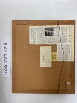Back of picture, including information about the author in writing and newspaper article 