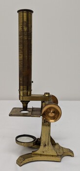 Brass and glass microscope made of 3 parts consisting of a Brass body, eye piece and eye piece adaptor. 