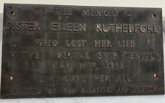 Memorial plaque for Sister Eileen Rutherford that had been attached to base of sundial
