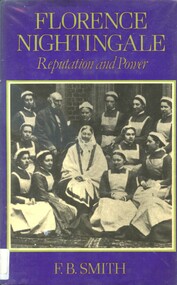 Hard cover book with dustjacket and protective covering. The dustjacket has a purple background, with title and author's name in grey print on front and spine. Front of dust jacket also has a black and white photograph of 12 women and a man. 10 of these women are in dressed in nurses uniforms, another wears a white cap, and the woman in the centre is wearing a white scarf on her head (Florence Nightingale with a group of nurses from London Hospitals at Claydon. Standing behind her are her brother in-in-law Sir Henry Verney (owner of Claydon) and the matron Miss Crossland). 
This book challenges the traditional view of Nightingale as a saintly figure, presenting a more complex and critical portrait. The book analyzes how Nightingale leveraged her personal relationships and influence to advance her public health and nursing reforms, highlighting her achievements and less savory tactics.