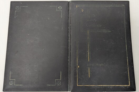 Cover of graduation certificate shows signs of wear