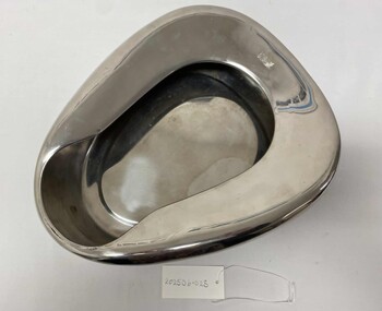 Oval, full size bedpan,  constructed of monumental, one piece.