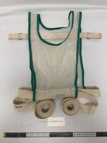 white mesh vest with green trim, off white cotton woven fabric strapping