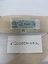 white label with green text on strapping - TO REORDER SPECIFY/POSEY PONCHO #3611/J.T.POSEY CO./ARCADIA, CA. 91006/.WASHABLE. LOGO OF 4 LEAF CLOVER TO THE LEFT OF LABEL, POSEY ACROSS VERTICAL AND HORIZONTAL LEAVES/Quality. underneath sizing label M