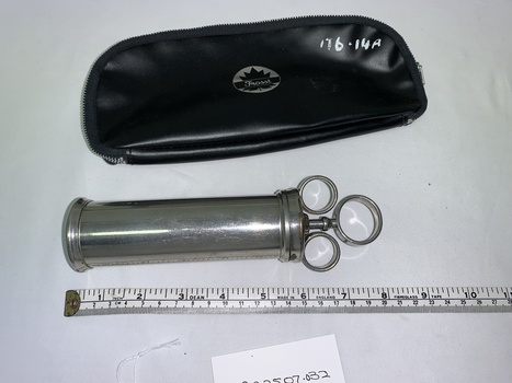 silver metal cylindrical barrel syringe and plunger, black vinyl case with zip closure