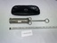 silver metal cylindrical syringe with plunger extended and black vinyl case