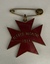 A red enamel badge in the shape of a star, reading "ALFRED HOSPITAL 1914," attached to a safety pin.