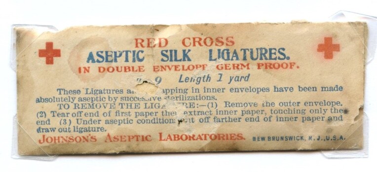 Front view of Red Cross aseptic silk ligatures in double envelope