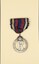 Front view of Queen Alexandra's Imperial Military Nursing Service Reserve (QAIMNSR) badge, 1915