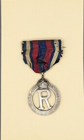 Front view of Queen Alexandra's Imperial Military Nursing Service Reserve (QAIMNSR) badge, 1915