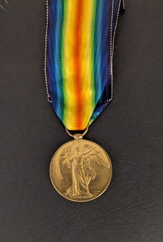 Front of Victory Medal with attached ribbon