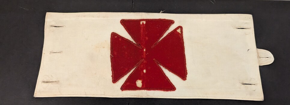 Fabric cross on white armband