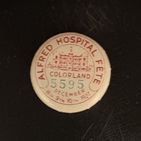 A red and white button featuring the text "Alfred Hospital" clearly visible on its surface.