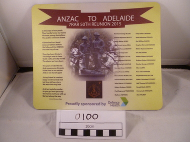 A Mouse pad with three columns of texts; image of two soldiers culpture in the middle and a crimson ribbon