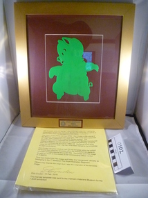 A green pig facing left on a crimson background with golden border.