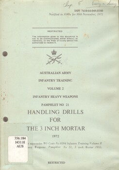 A greenish gray coloured covered manual with two punch holes down the left hand side. The information on the front cover is in black ink