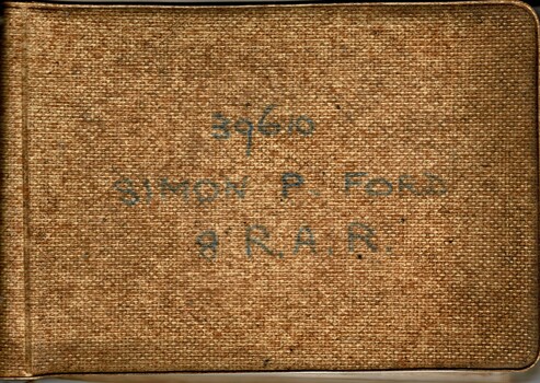 A brownish plastic cover with the following written in black. 39610 Simon P. Ford, 8 R.A.R.