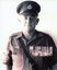 
Sepia photo of David Norman Ogg, RAAF Aircraftman, in uniform with cap and medals, post-Vietnam