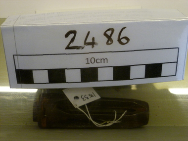 A damaged flash eliminator from a M60 machine gun. 