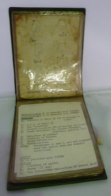 A pocket book with vinyl folder with plastic sleeves containing instructions.