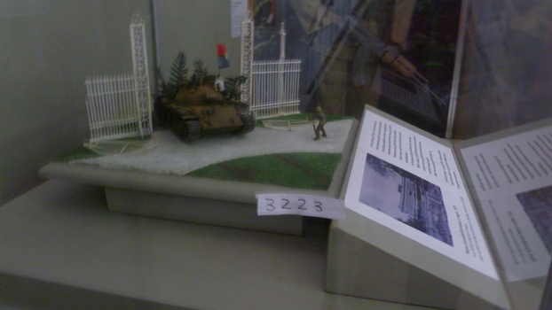 A Diorama depicts second tank, NR844 passing through the ruined gates of the Presidential Palace