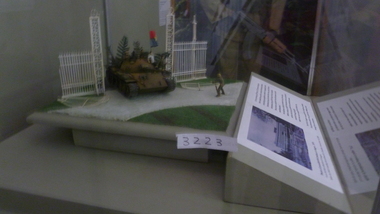 A Diorama depicts second tank, NR844 passing through the ruined gates of the Presidential Palace