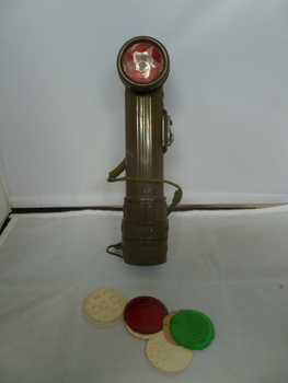 Olive green plastic with coloured filters stored in handle.