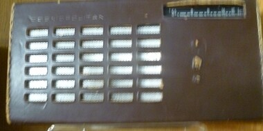 Phillips black and silver transistor radio in a brown case