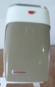 White and fawn metal and plastic cordless razor