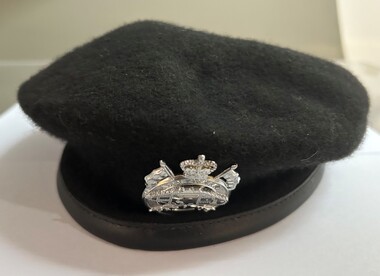 Black beret with a leather trim
