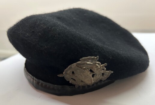 Black wool beret with leather trim