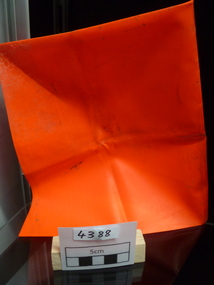 Red fluoro plastic square used for identification of patrol location for aircraft.