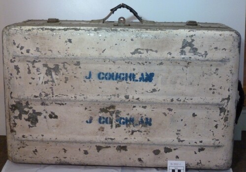 Trunk, all metal rectangular shape with the name Coughlan on the top
